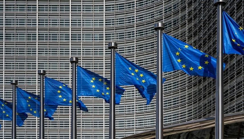European flags in front of headquarters of European commission in Brussels in summer day