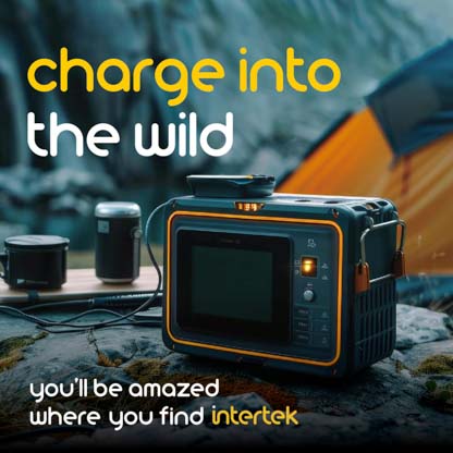 A portable powerbank sitting outside next to a tent