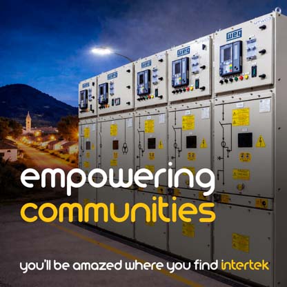 An electric power management console with a rural community visible in the background